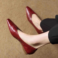 Maroon leather pointed-toe mule with low heel, shown from side view