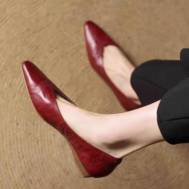 Maroon leather pointed-toe mule with low heel, shown from side view