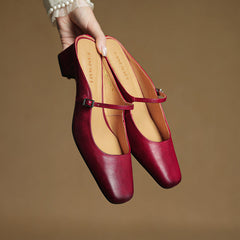 Pair of red genuine leather mules with adjustable slingback strap and low block heel