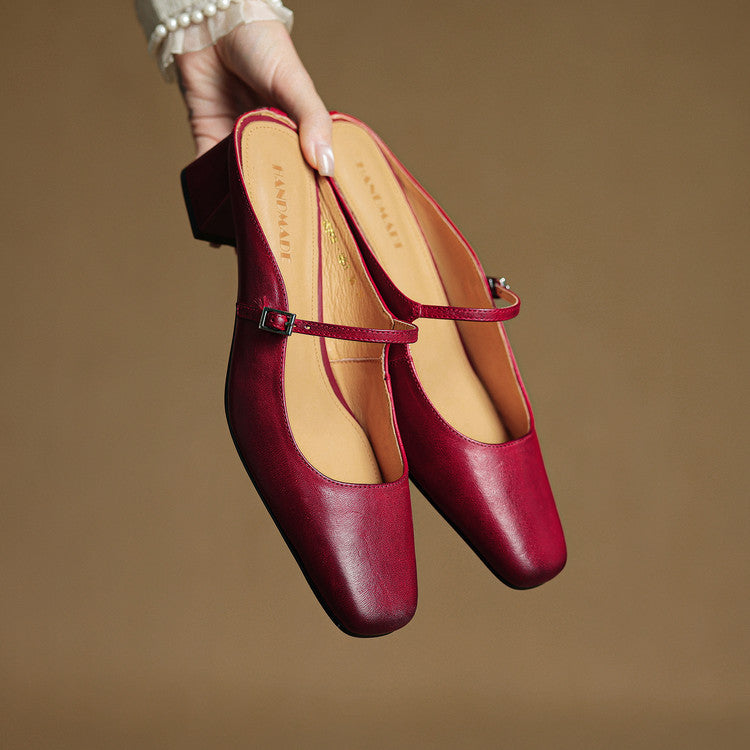Pair of red genuine leather mules with adjustable slingback strap and low block heel
