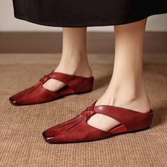Red square-toe genuine leather mules with cushioned lining and small strap.