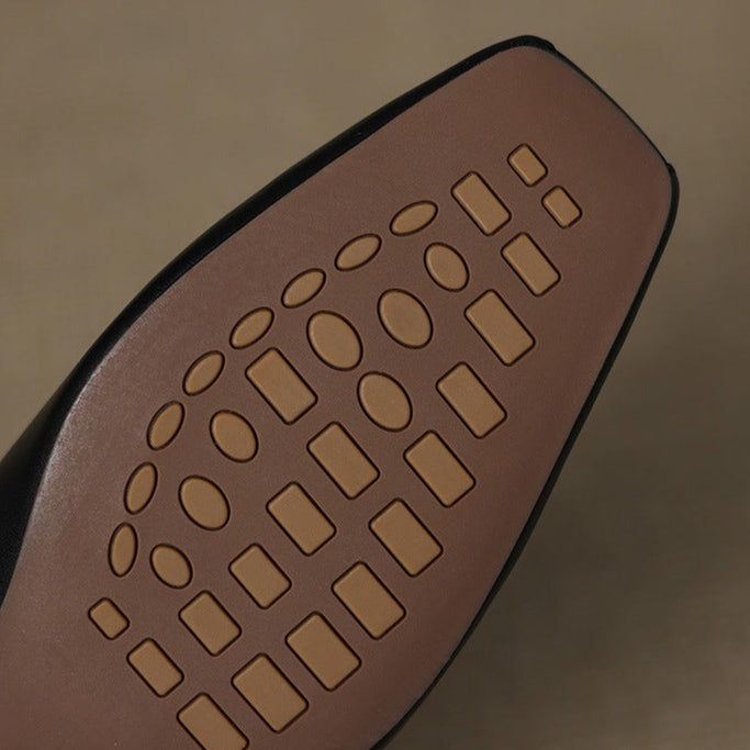 Leather mule outsole with embossed tread pattern
