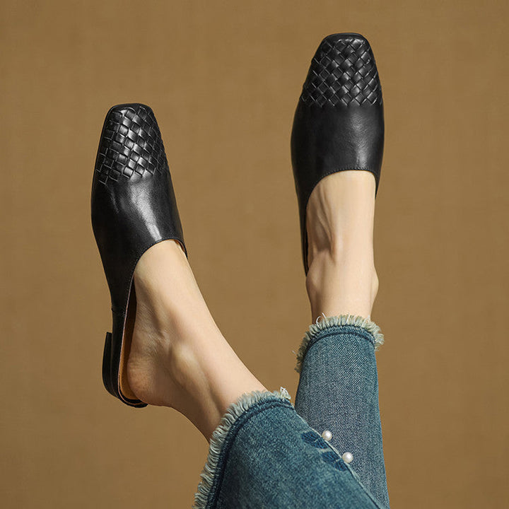 Black woven leather mule flats with open back and low block heel