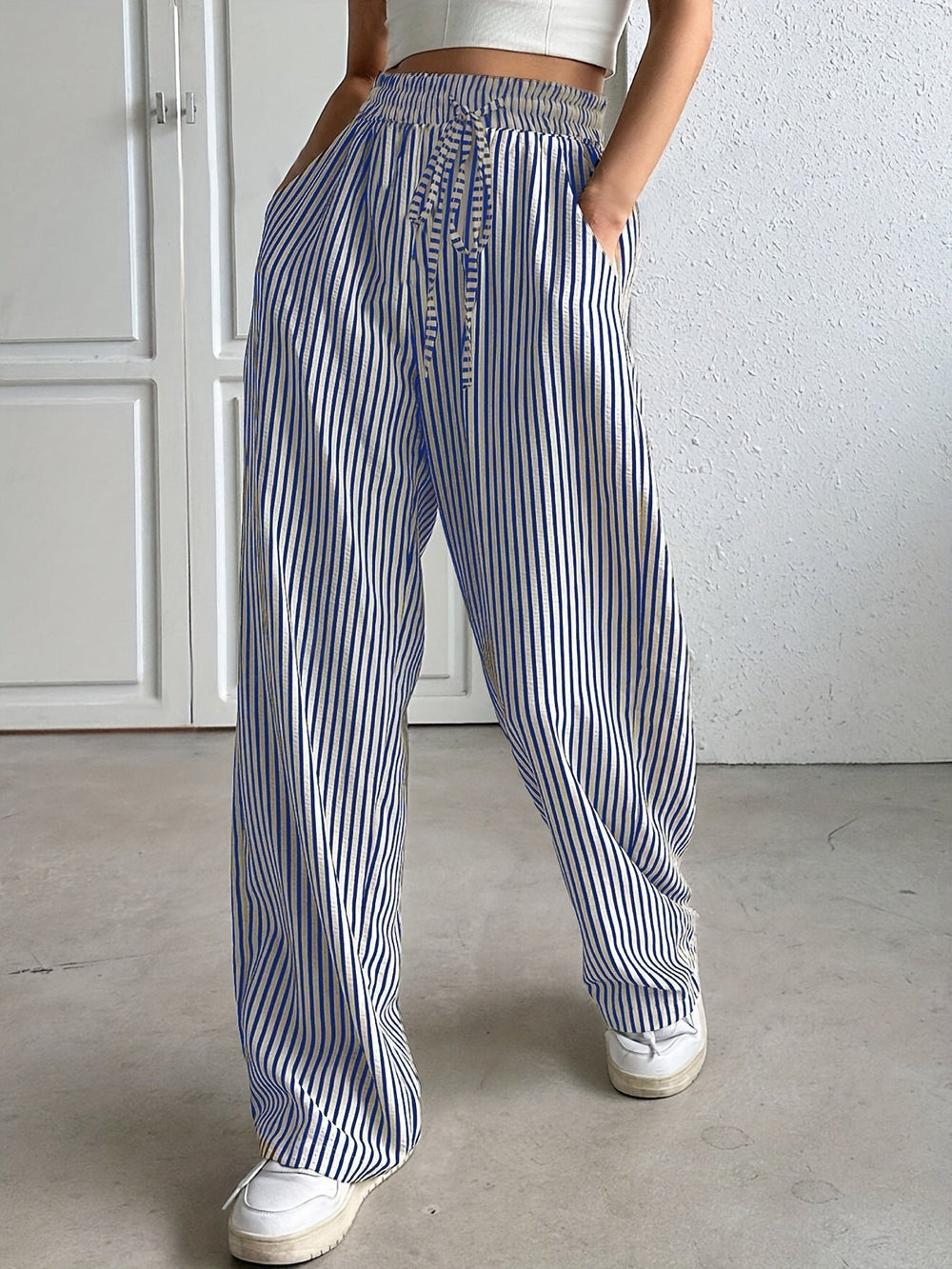 Blue striped trousers with drawstring waist and wide leg
