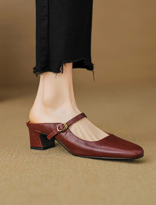 Maroon leather mule with low block heel and slip-on strap with gold buckle