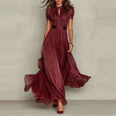 Red chiffon maxi dress with puff sleeves, keyhole neckline, pleated waist, flared skirt