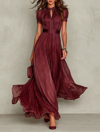Red chiffon maxi dress with puff sleeves, keyhole neckline, pleated waist, flared skirt