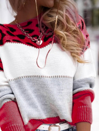 Leopard-print knit sweater with white chest and red lower panel, long sleeves
