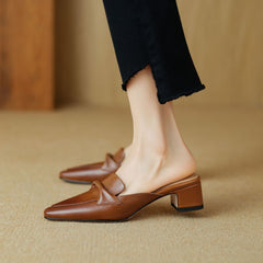 Brown leather mule with square toe and low block heel, slip-on design with strap detail