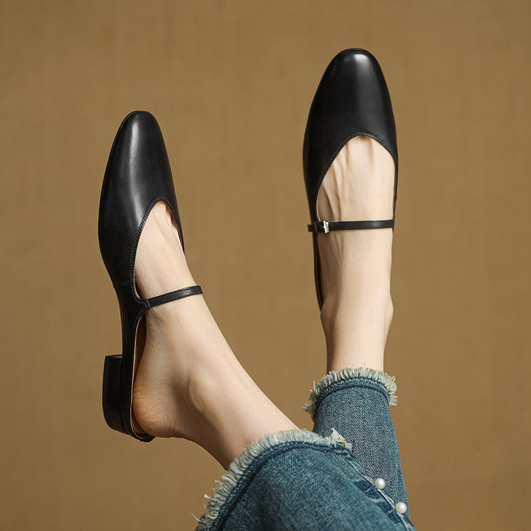 Black genuine leather mules with adjustable buckle strap and low stacked heel