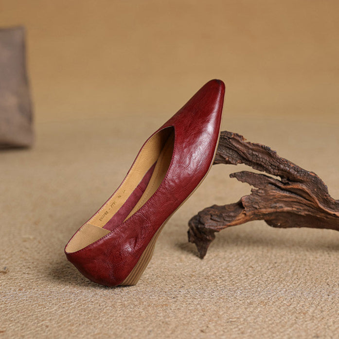 Maroon leather pointed-toe mule with low heel, interior lining visible