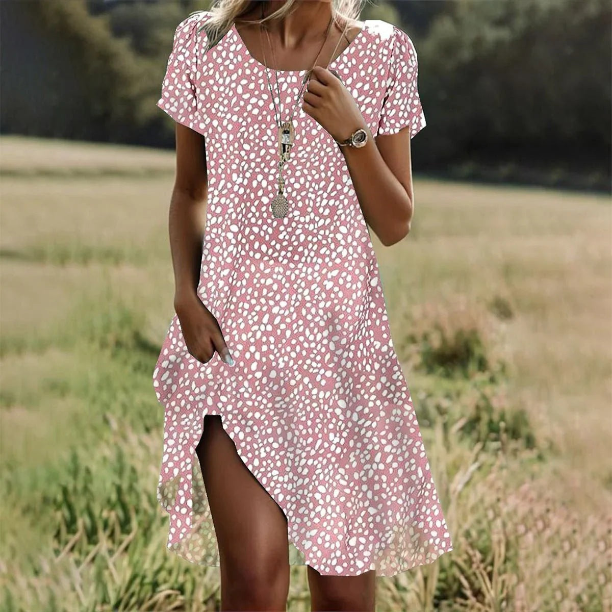 Pink short-sleeve midi dress with white dot print, V-neck and side slit