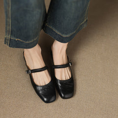 Black leather Mary Jane mule flats with ankle strap and metal buckle, low block heel