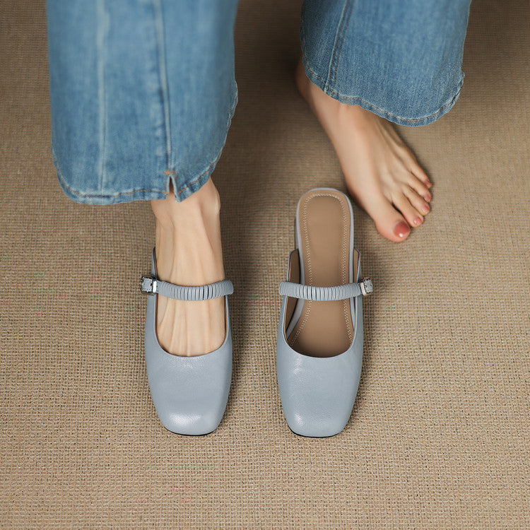 Pair of light blue leather Mary Jane mules with elastic strap and low block heel