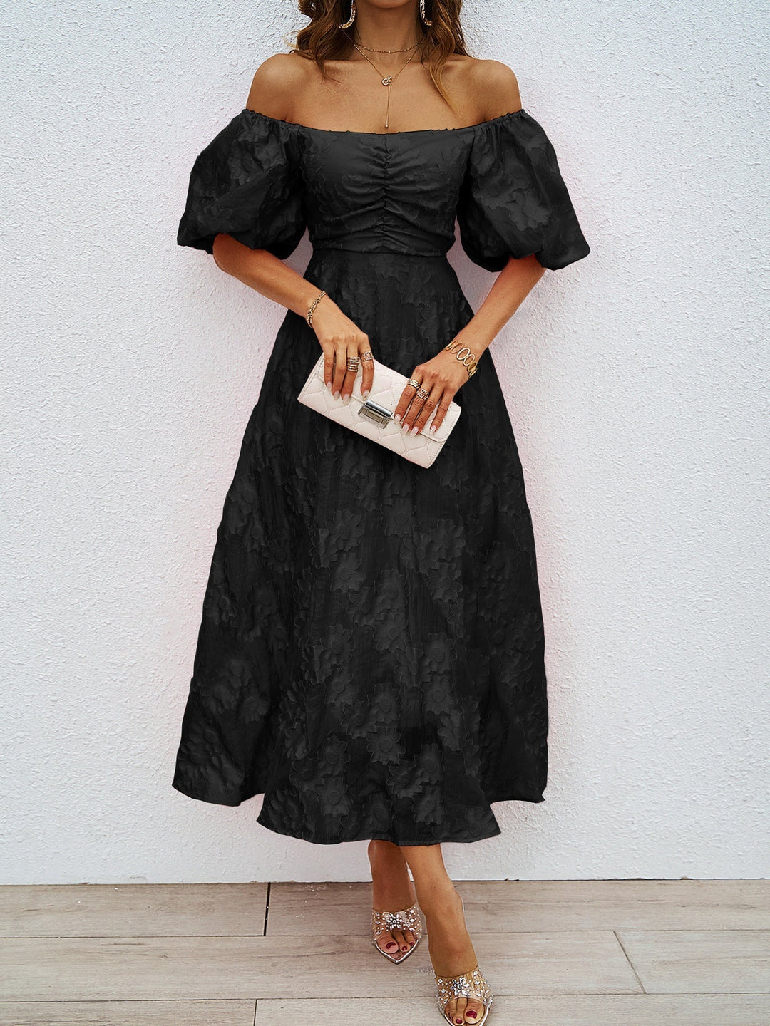 Black off-shoulder midi dress with puff sleeves and cinched waist
