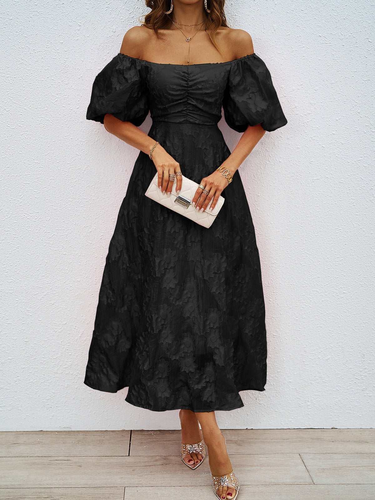 Black off-shoulder midi dress with puff sleeves and cinched waist