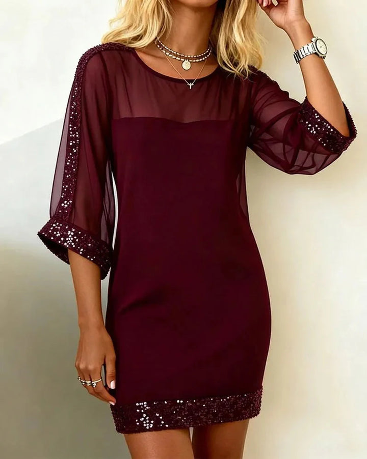 Burgundy elegant dress with sheer sleeves, scoop neck, and glitter trim hem
