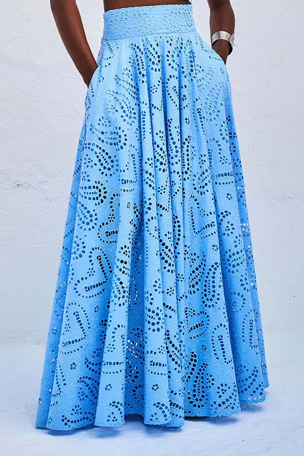 Women’s eyelet sleeveless maxi skirt set in light blue, full skirt with lace cutouts.