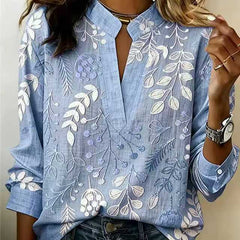 Dusty blue embroidered popover blouse with V-neck, front slit, and 3/4 sleeves