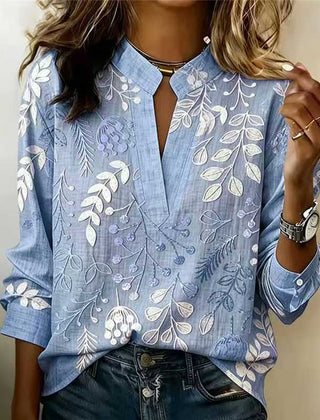 Dusty blue embroidered popover blouse with V-neck, front slit, and 3/4 sleeves