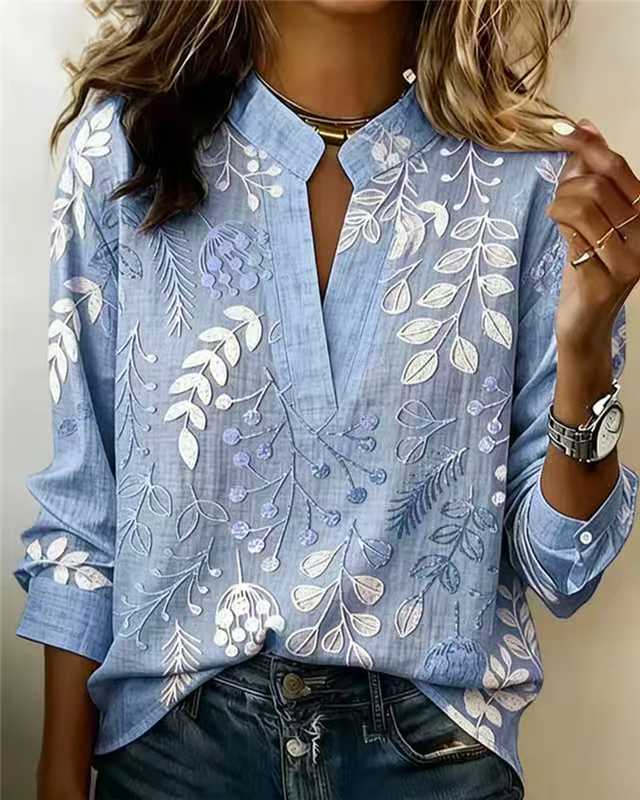 Dusty blue embroidered popover blouse with V-neck, front slit, and 3/4 sleeves