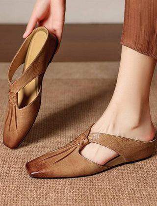 Brown tan square-toe genuine leather mule with strap and low, flat sole.