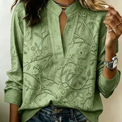 Green embroidered vine popover blouse with V-neck and three-quarter sleeves
