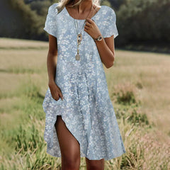 Light blue short-sleeve midi dress with white floral print, V-neck and side slit