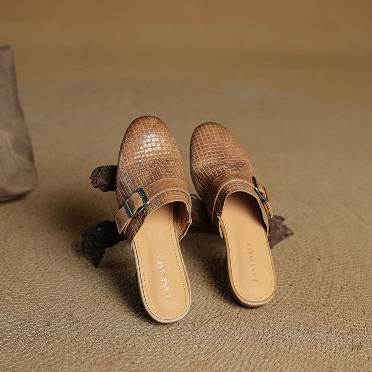 Tan woven leather mules with buckle strap and flat slide sole