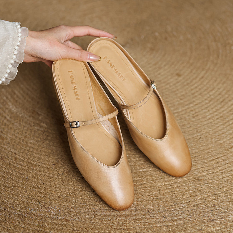 Apricot leather pointed-toe mules with cross straps and buckle, low sole
