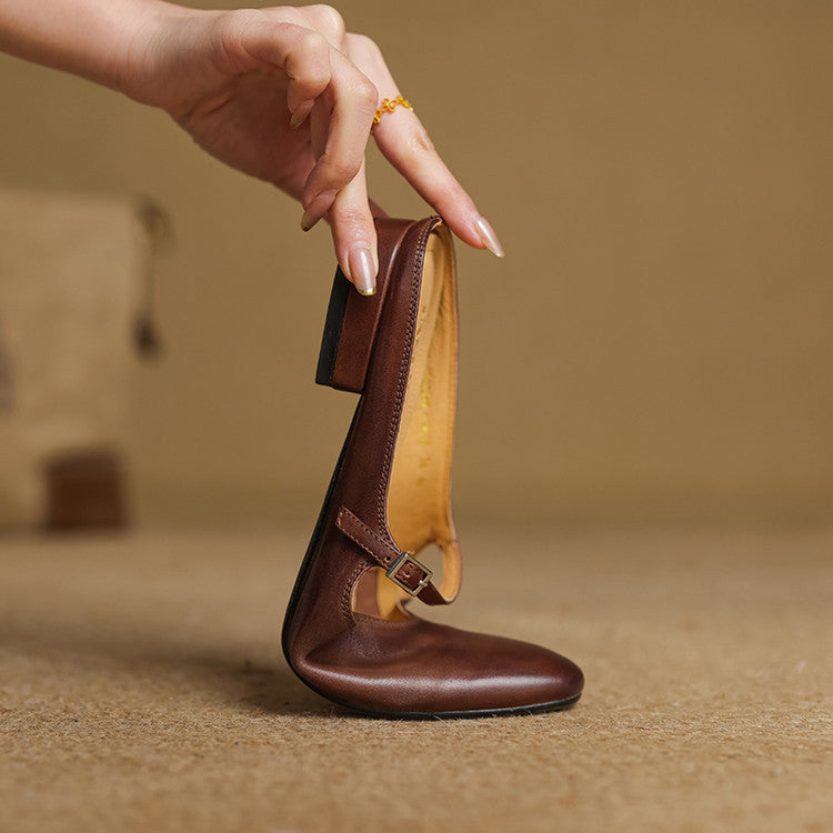 Brown leather slingback mules with buckle strap, rounded low heel
