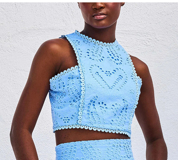 Women’s eyelet sleeveless crop-top set in light blue, high neckline with lace texture.