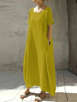 Bright yellow casual maxi dress with short sleeves and round neckline, flowing fit
