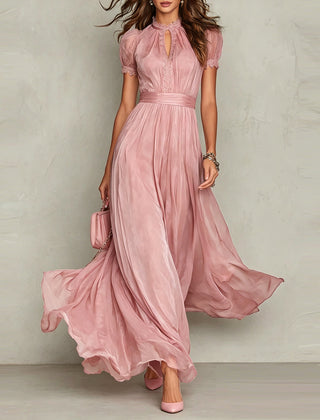 Pink chiffon maxi dress with puff sleeves and keyhole neckline, pleated empire waist, flared skirt