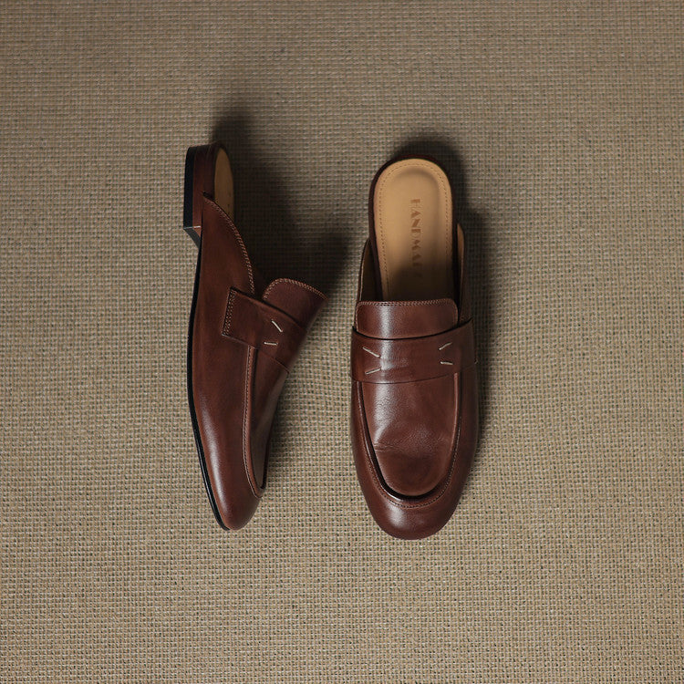 Brown leather mules showing side profile and open-back slip-on strap