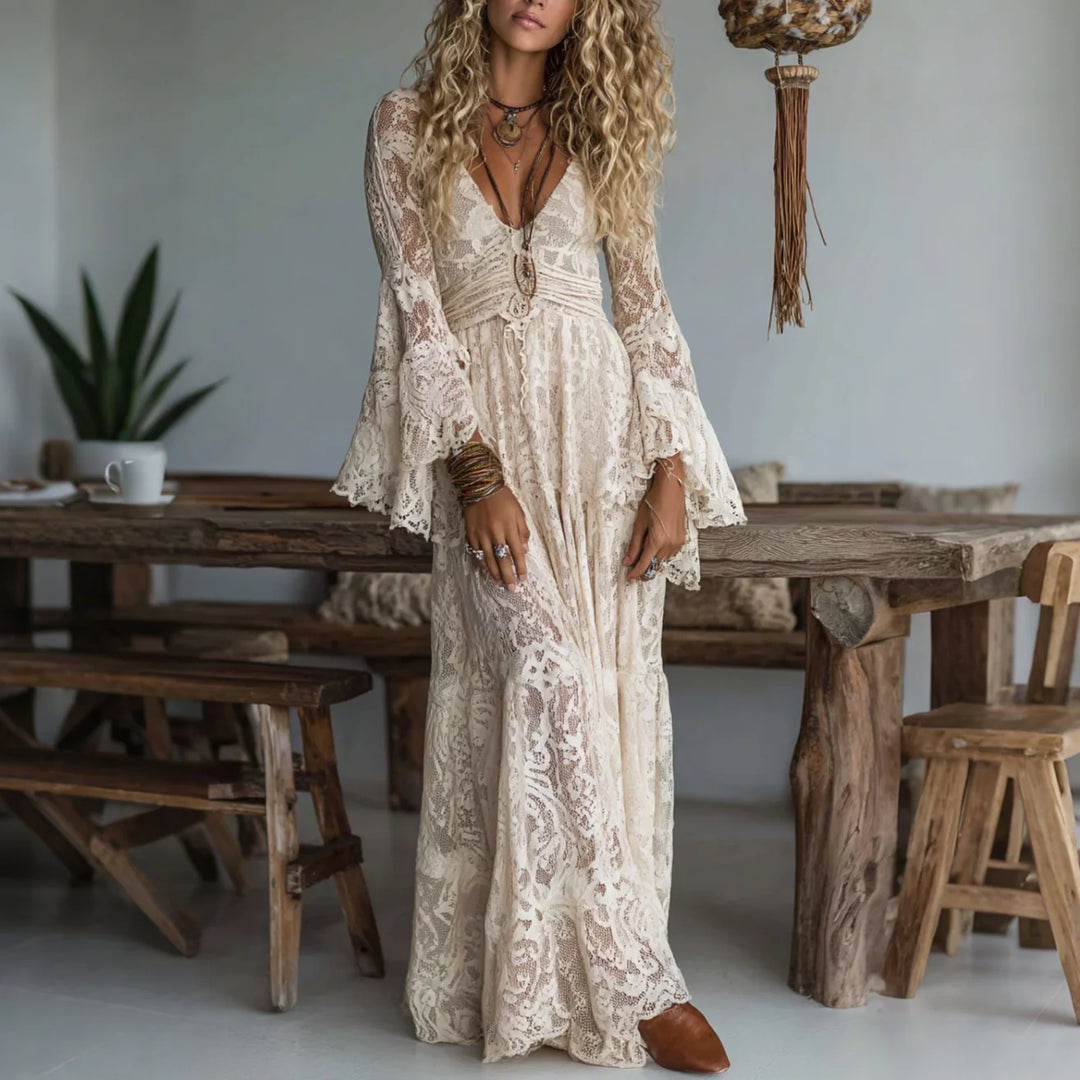 Ivory lace maxi dress with V-neck, long bell sleeves, and flowing skirt