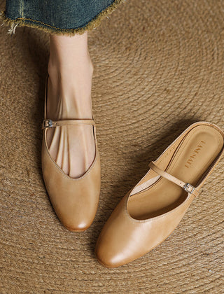 Genuine leather mules in light tan with slip-on design, strap, and buckle detail