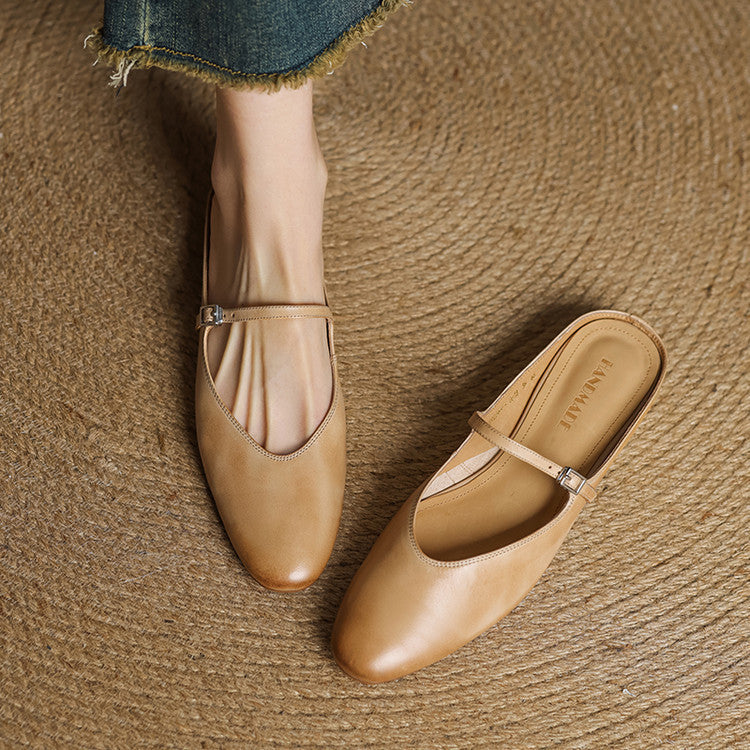 Genuine leather mules in light tan with slip-on design, strap, and buckle detail
