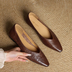 Dark brown genuine leather mules with almond toe and slip-on design