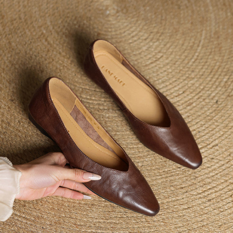 Dark brown genuine leather mules with almond toe and slip-on design