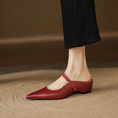 Maroon leather mules featuring pointed toe, slingback strap, and low block heel