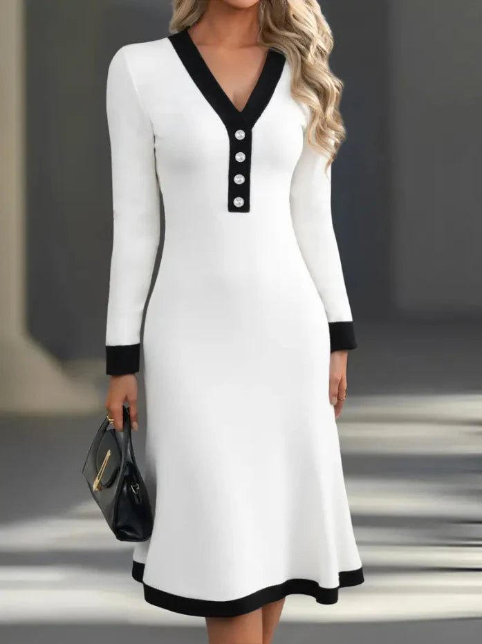 White long-sleeve V-neck midi dress with black trim and button-front placket