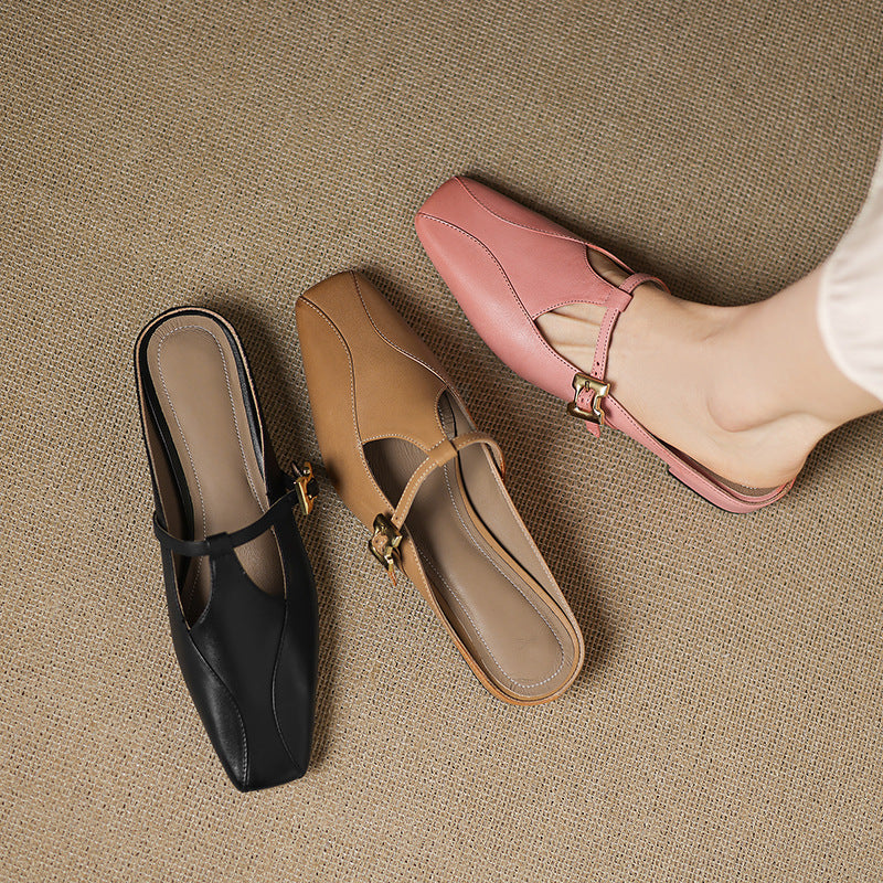 Assorted leather mules in pink, black, and tan, each with gold buckle sling strap
