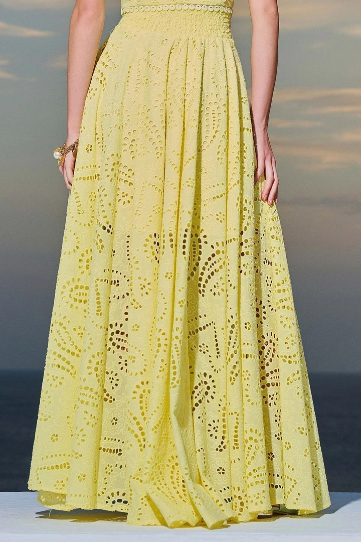 Women’s eyelet sleeveless maxi dress set in yellow, cropped top and full tiered skirt.