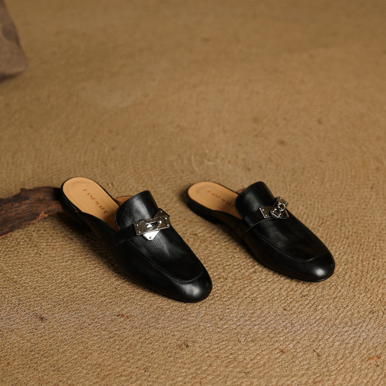 Black mule slides with silver buckle strap and rounded square toe