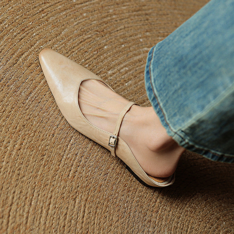 Beige pointed-toe mule with ankle strap and buckle detail