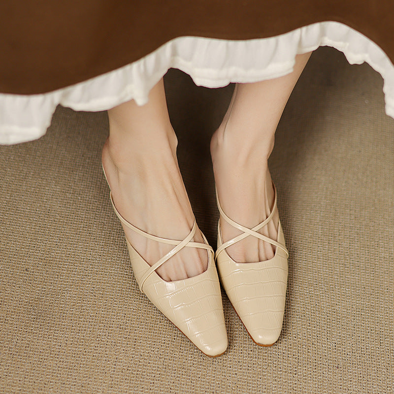 Beige pointed-toe mules with crisscross straps and low heel