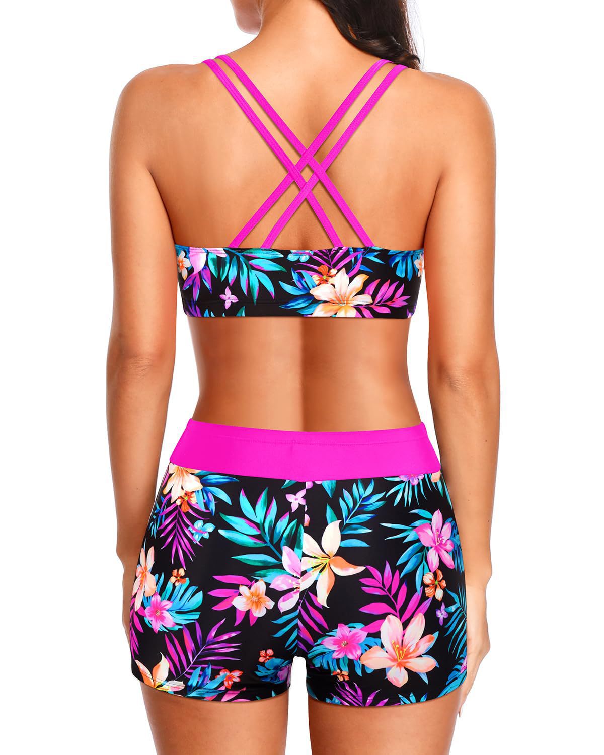 Tropical swim set from behind with pink straps, floral bandeau top, and matching shorts