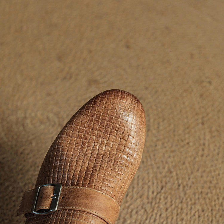Brown woven leather mule with adjustable buckle strap, close-up view