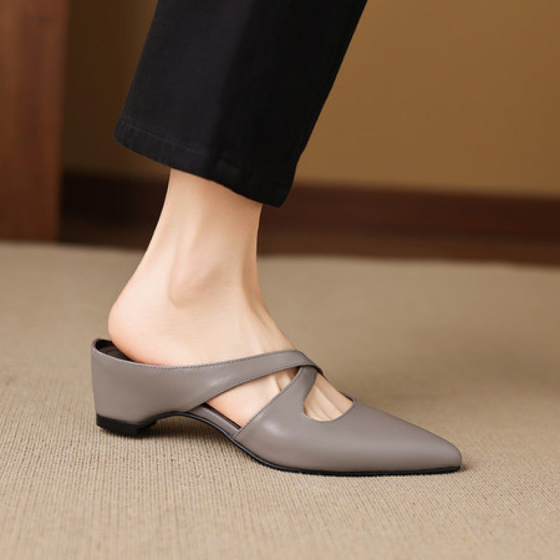 Gray pointed-toe mules with cross-strap detail and low block heel